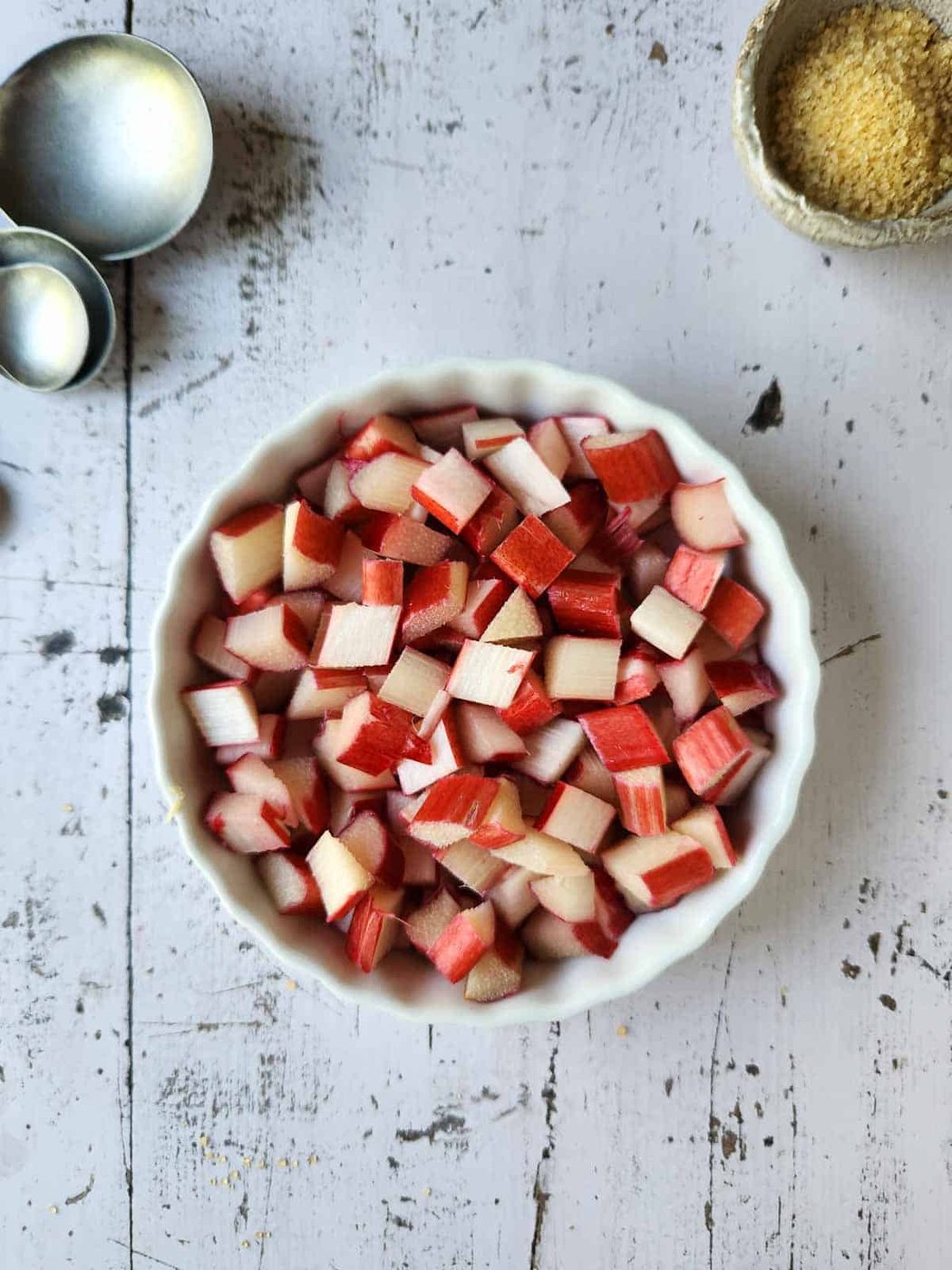 Diced rhubarb in a white dish.