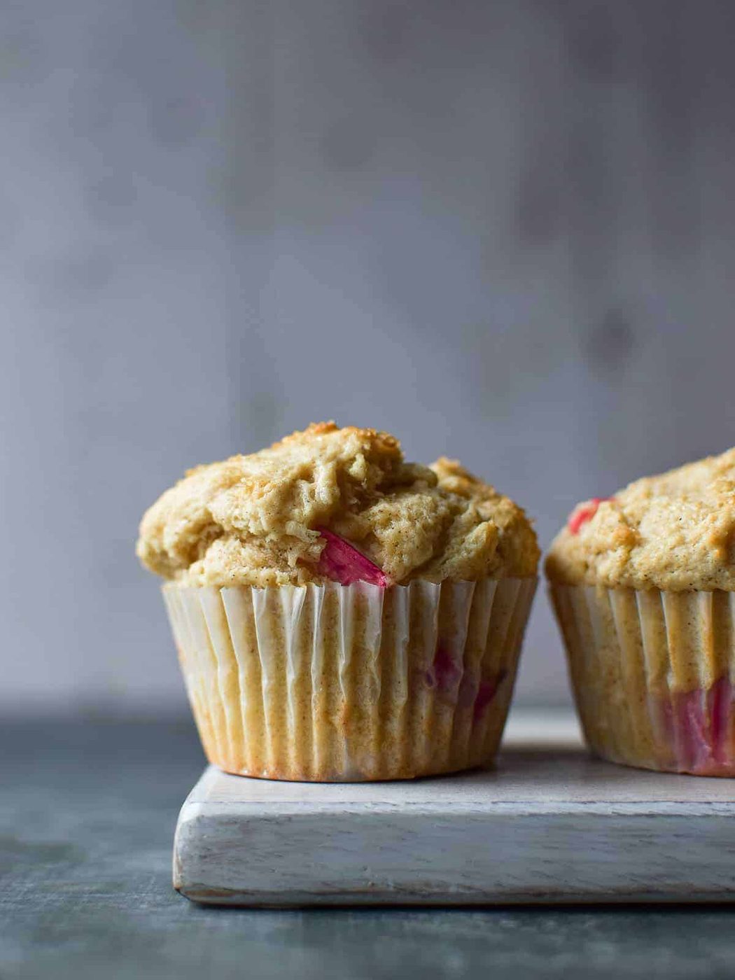 Close-up of a muffin on a grey surface.