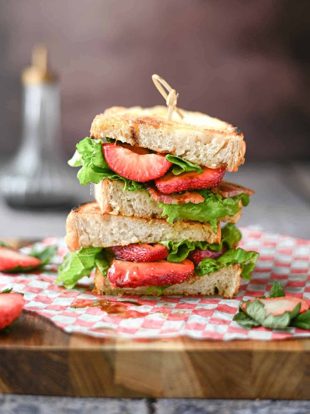 Stacked BLT with strawberries, lettuce and bacon.