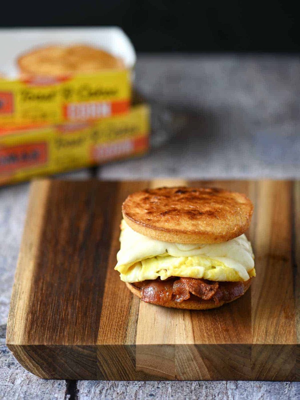 Toaster cake sandwich on a wooden cutting board.