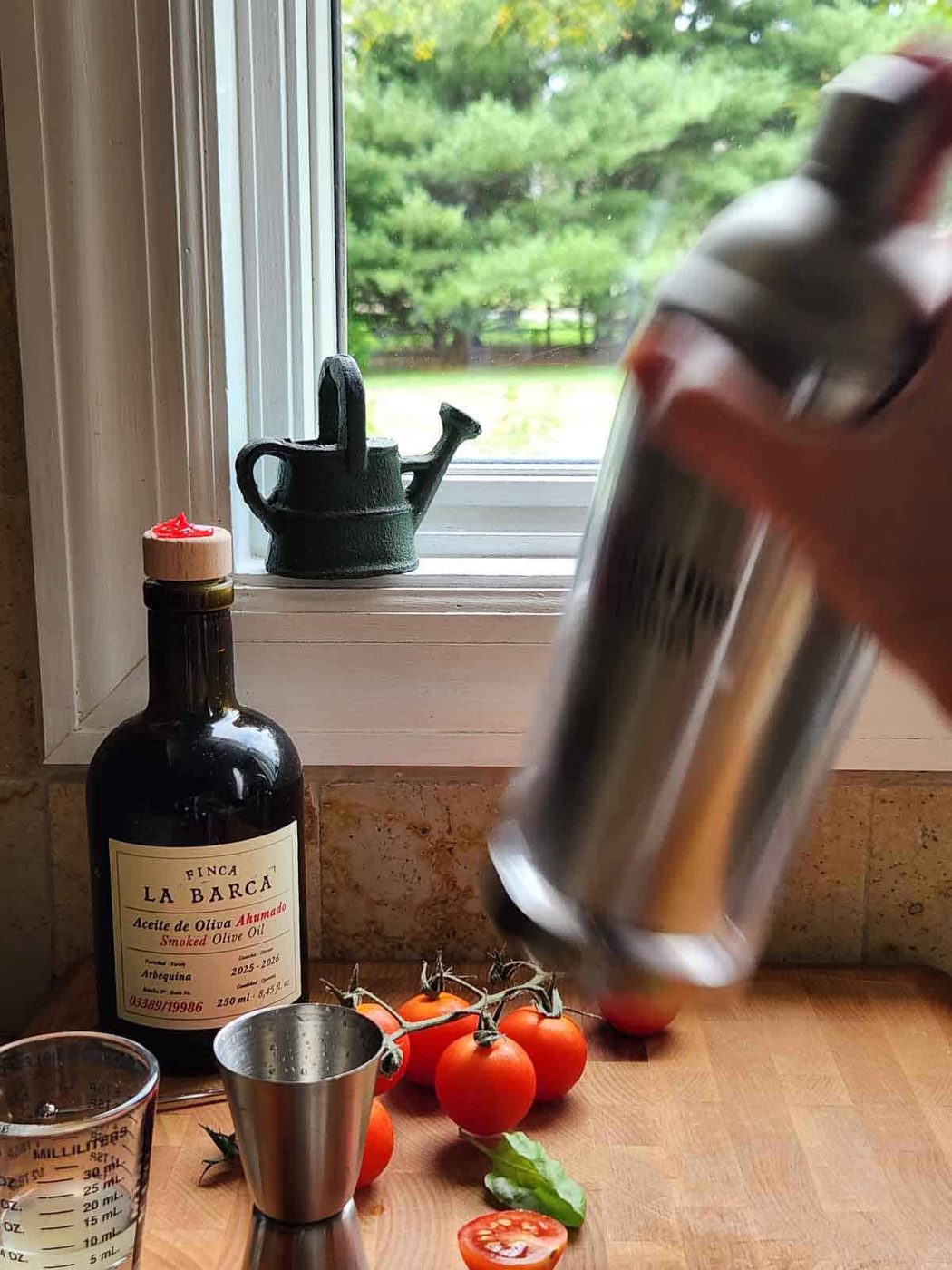 A blurry picture of a cocktail shaker being shaked.