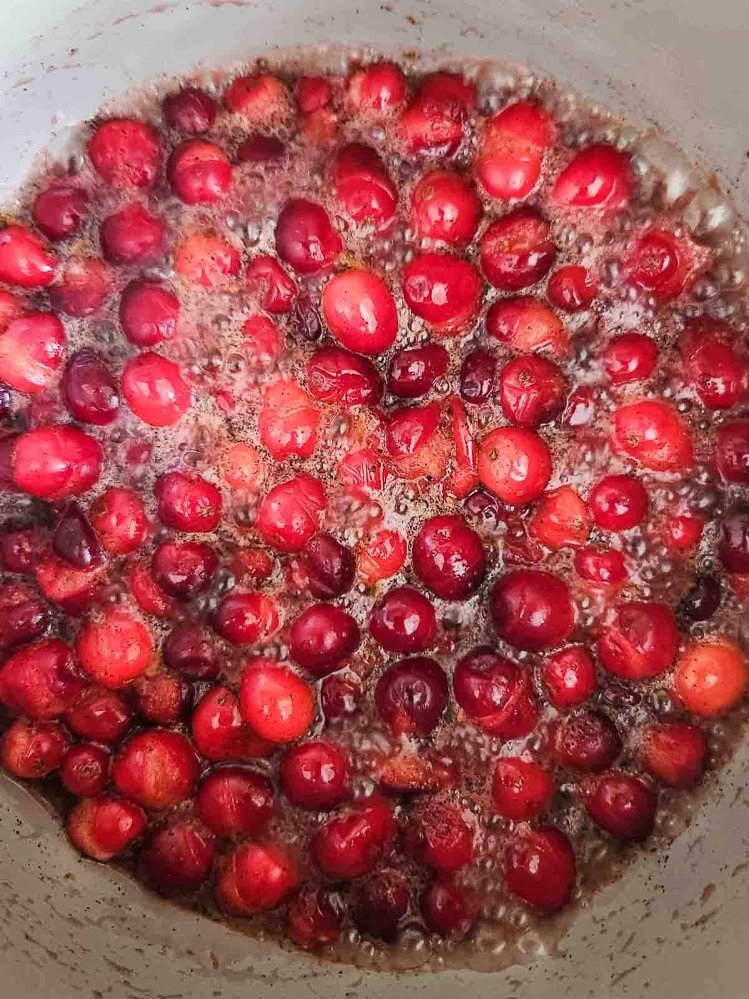 Boiled cranberries in a pot.