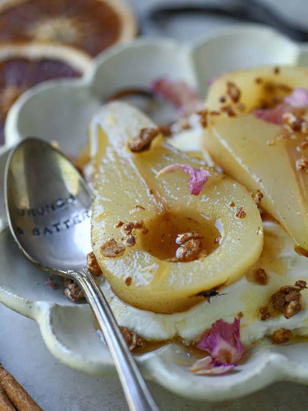 Close-up of vanilla-poached pears with yogurt.
