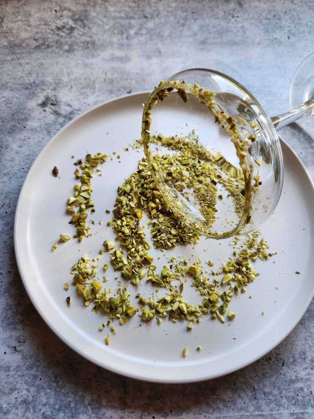Martini glass dipped in crushed pistachios.
