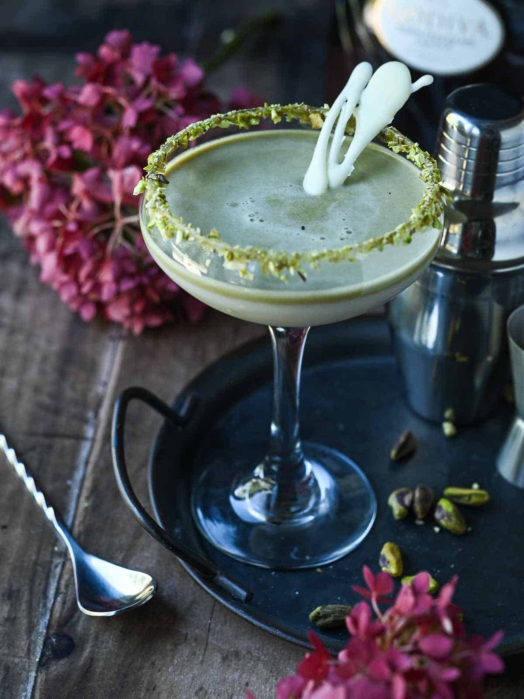 Pistachio and white chocolate martini on a tray.
