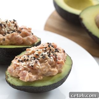 Easy low carb spicy tuna stuffed avocados.