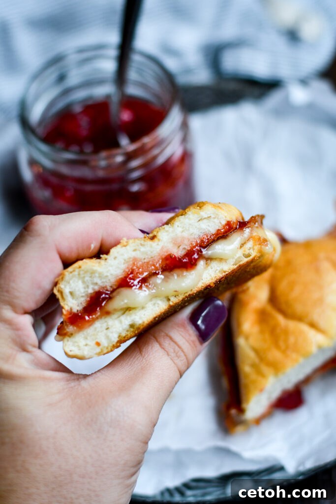 Grilled cheese perfection: Brie, Bacon, and Strawberry Jam come together for a delicious bite! A must-try recipe.