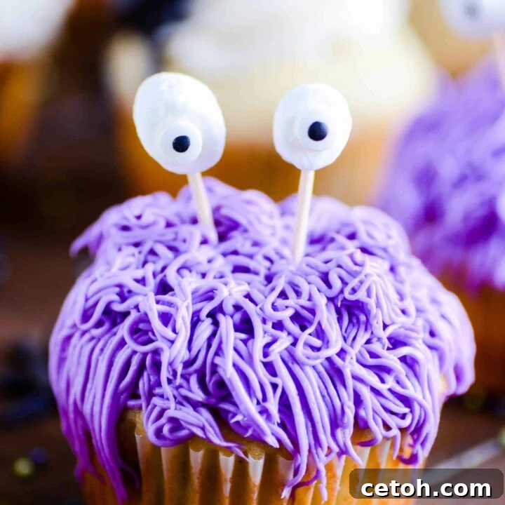 Perfectly baked vanilla cupcakes topped with smooth vanilla buttercream frosting, ready for decoration.