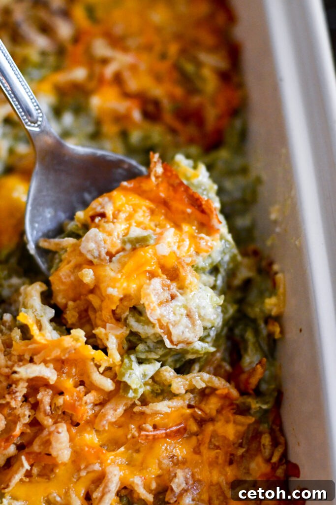 Comfort food at its best! This green bean casserole from scratch has creamy sauce and crispy onions in every bite.
