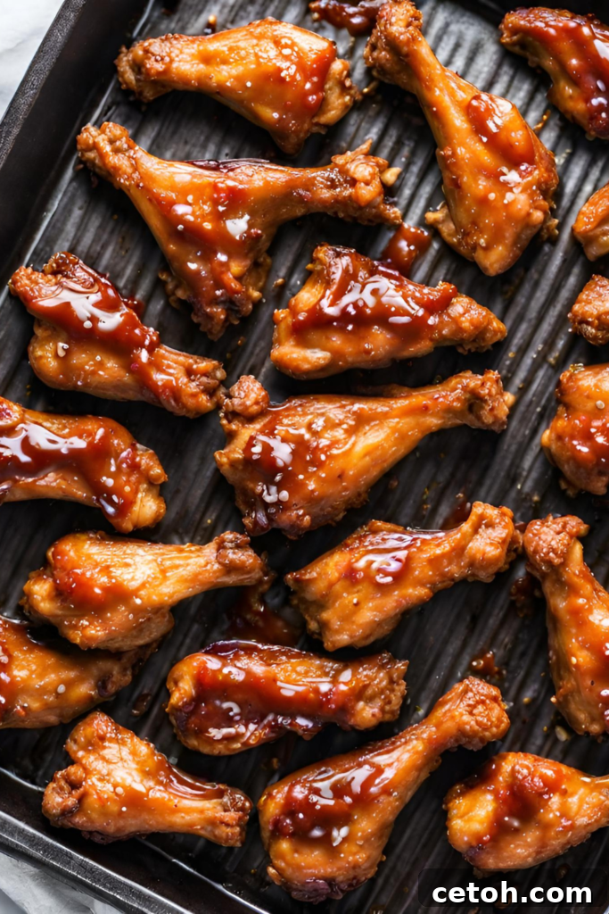 Step-by-step guide to crafting the most irresistible Sticky BBQ Wings in your oven.