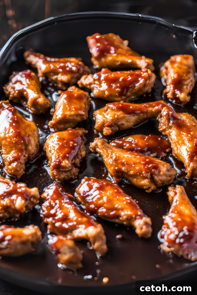 Discover a hassle-free method for creating mouthwatering Sticky BBQ Wings at home.