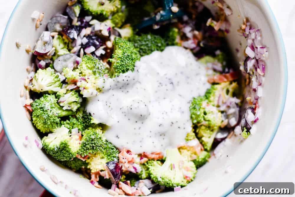 Mixing bowl with crisp broccoli, sweet grapes, and savory bacon for a quick side dish