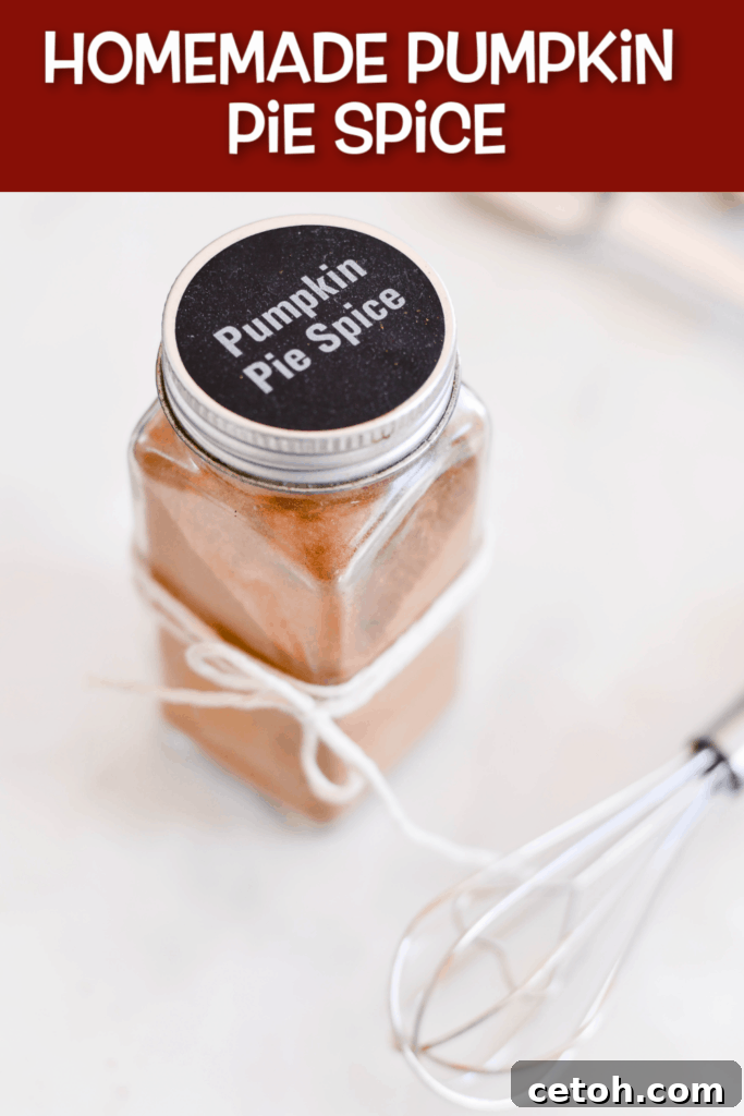 A beautiful display of homemade pumpkin pie spice in a jar, surrounded by whole spices and autumnal decorations, highlighting its freshness and homemade appeal. #pumpkin #recipe #baking #dessert #diy #hack #homemade