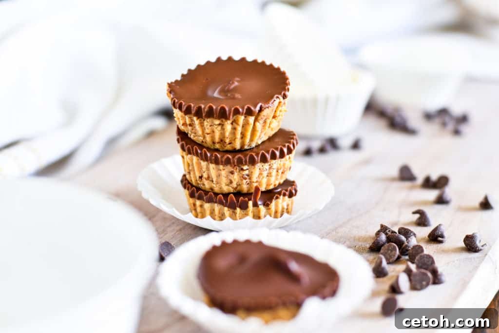 High-Protein Peanut Butter Cups 3 A close-up shot of a stack of golden protein peanut butter cups, highlighting their perfect form and inviting texture, ready to be enjoyed as a healthy snack.