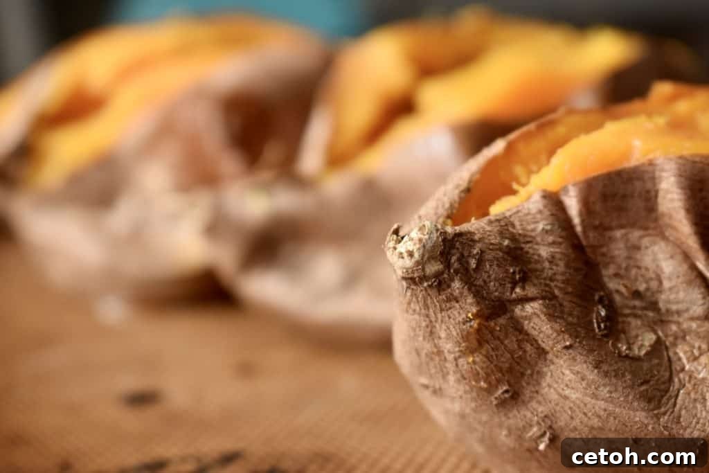 Perfectly oven baked sweet potato with steam rising