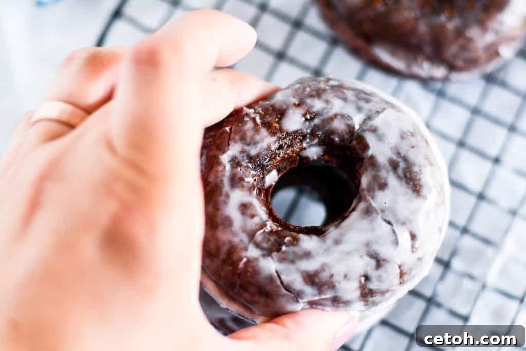 Guilt-Free Chocolate Protein Donuts 3 Close-up of baked chocolate protein donuts, showcasing their rich color and inviting texture.