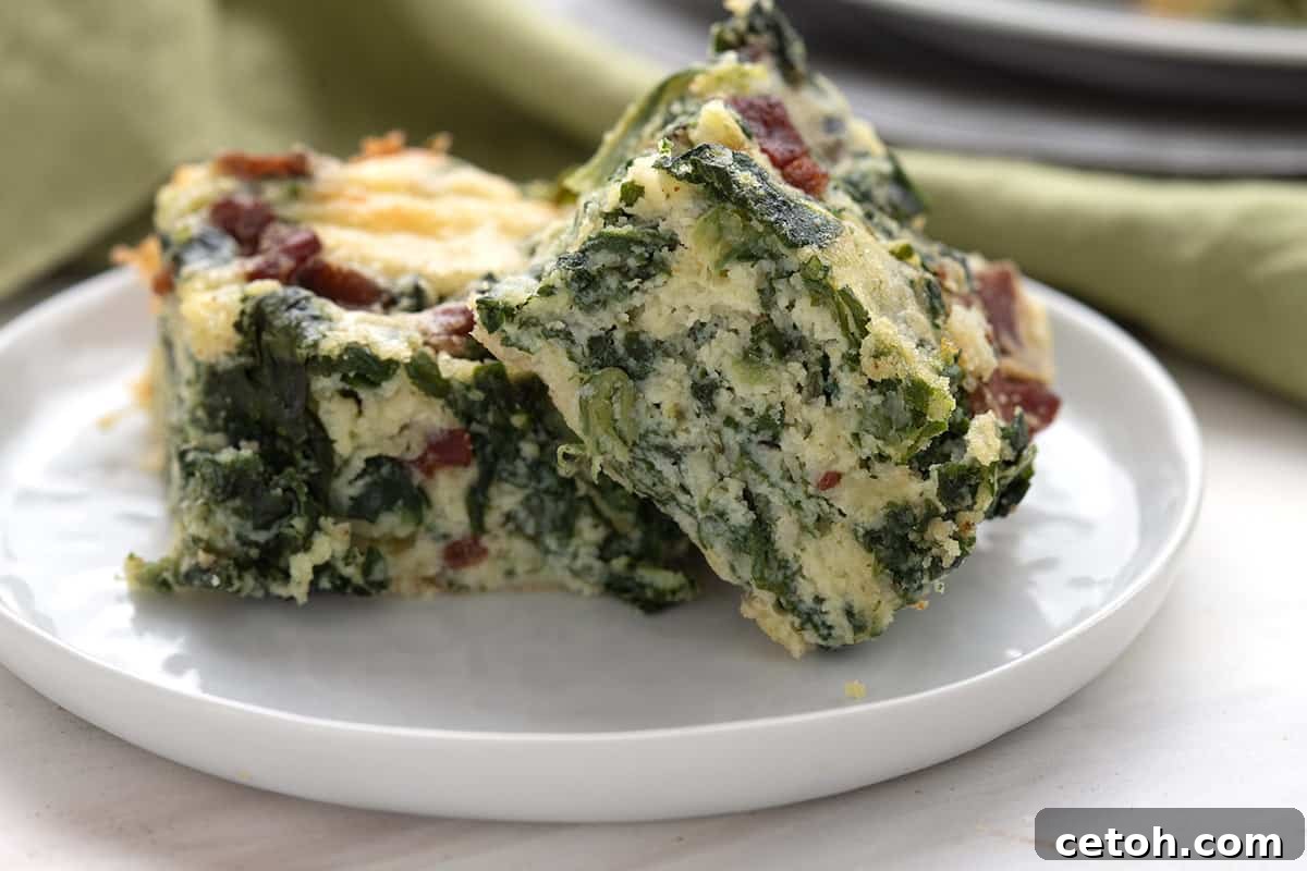 Keto Countdown Nibbles for New Year's Eve 9 Close up shot of spinach squares on a white plate.