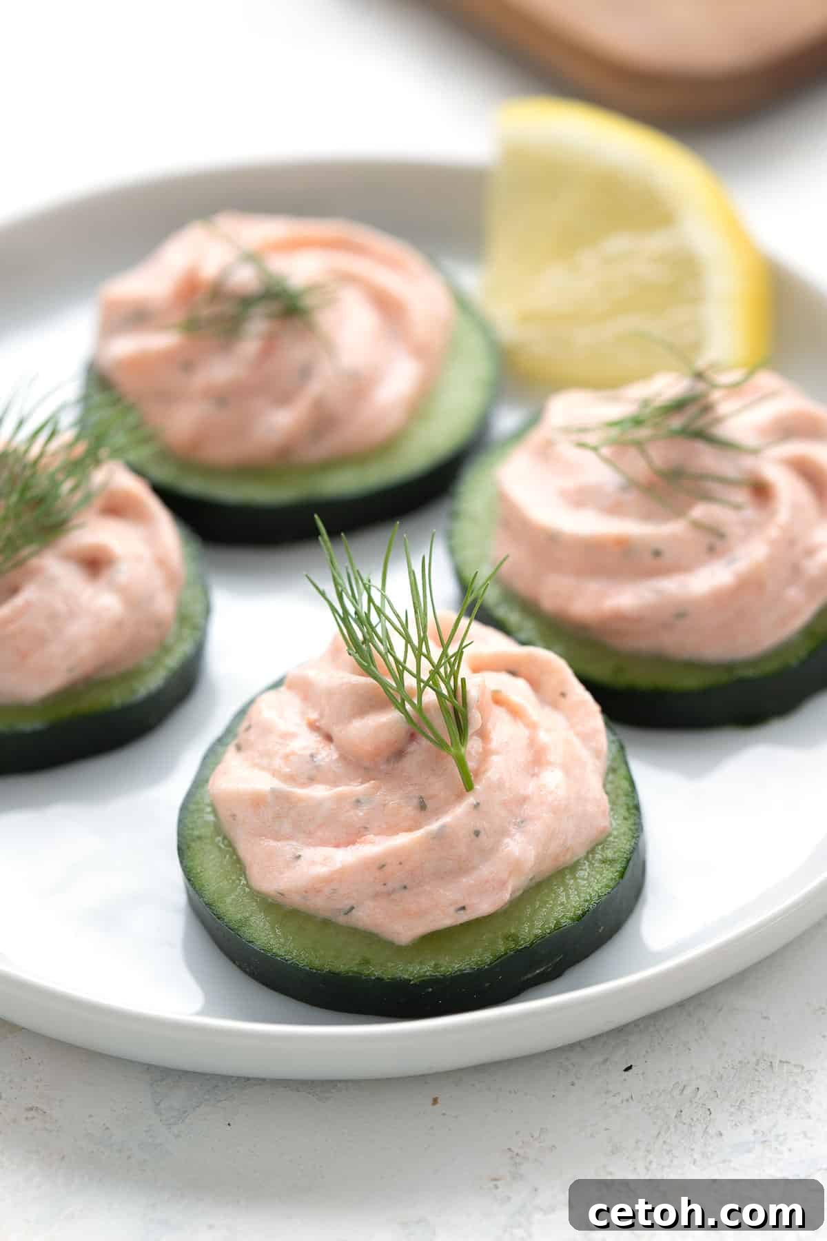 Keto Countdown Nibbles for New Year's Eve 16 Close up shot of smoked salmon mousse cucumber appetizers.