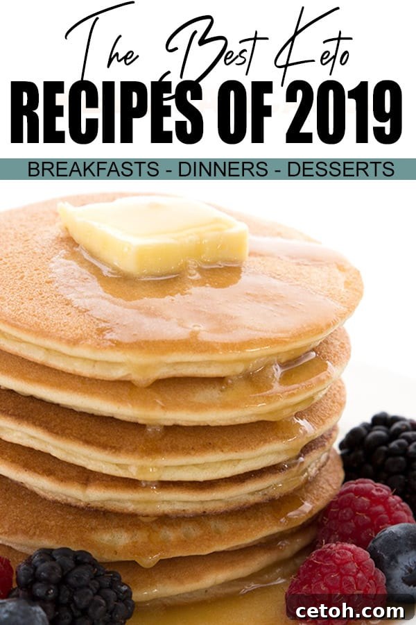 Featured recipe for the best keto recipes of 2019. A stack of almond flour pancakes with butter melting on top, alongside fresh berries and sugar-free syrup.