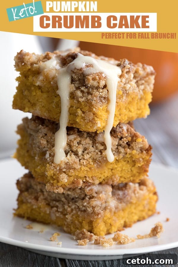 A stack of delicious Keto Pumpkin Crumb Cake slices on a white plate, showcasing the crumb topping and moist interior.