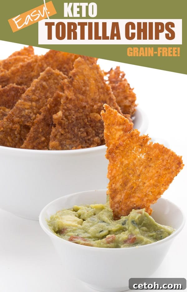 Crispy keto-friendly tortilla chips being dipped into a bowl of fresh guacamole.