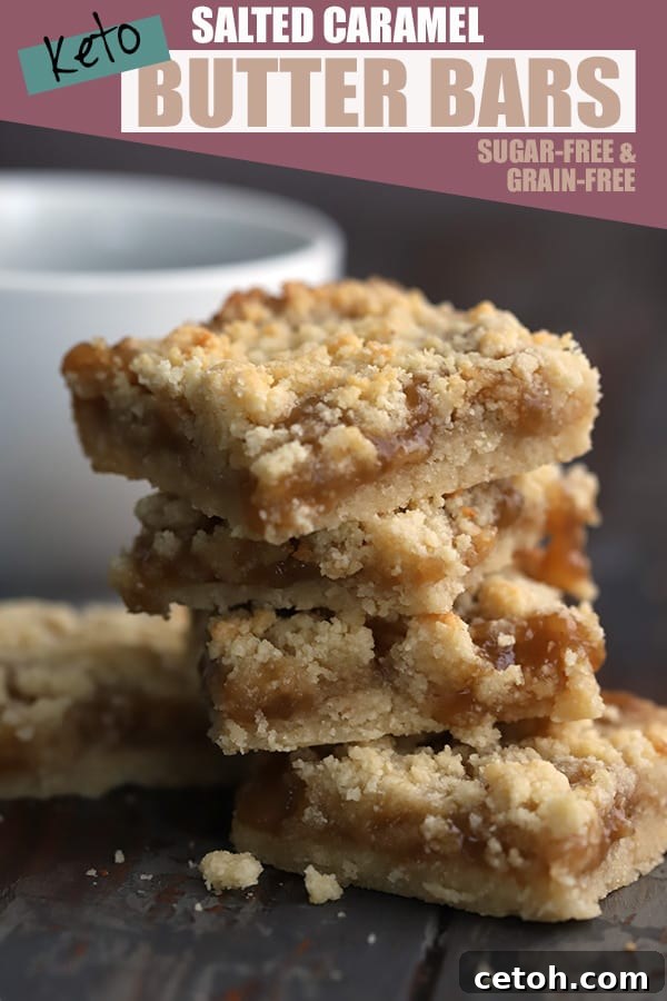 A stack of luscious sugar-free salted caramel butter bars in front of a warm cup of coffee, highlighting their rich layers.