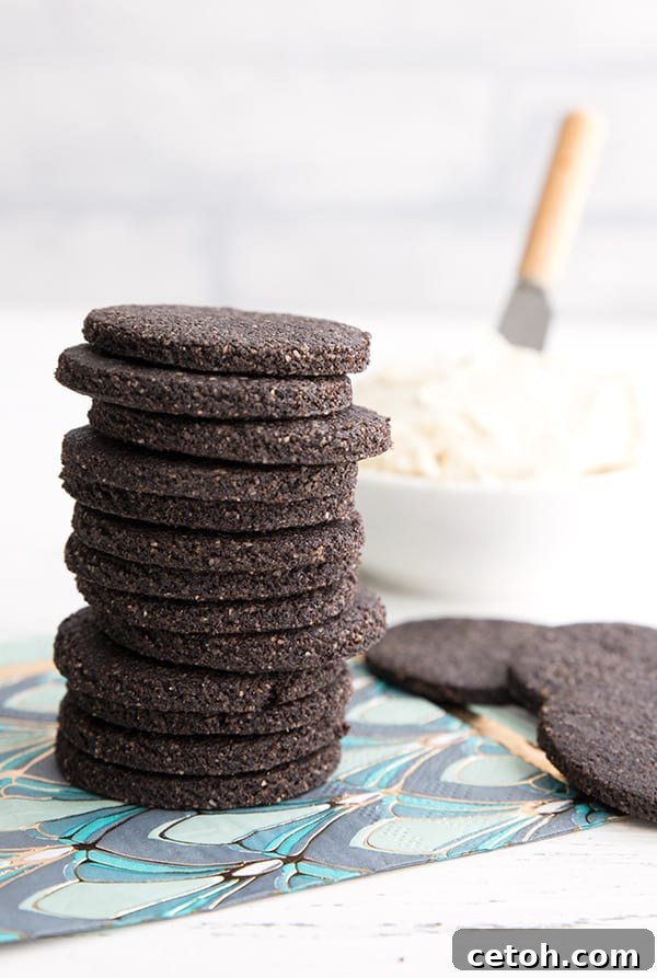 A stack of keto chocolate wafer cookies on a pattered napkin