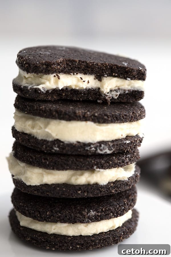 Close up shot of keto oreo cookies with a bite taken out of the top cookie