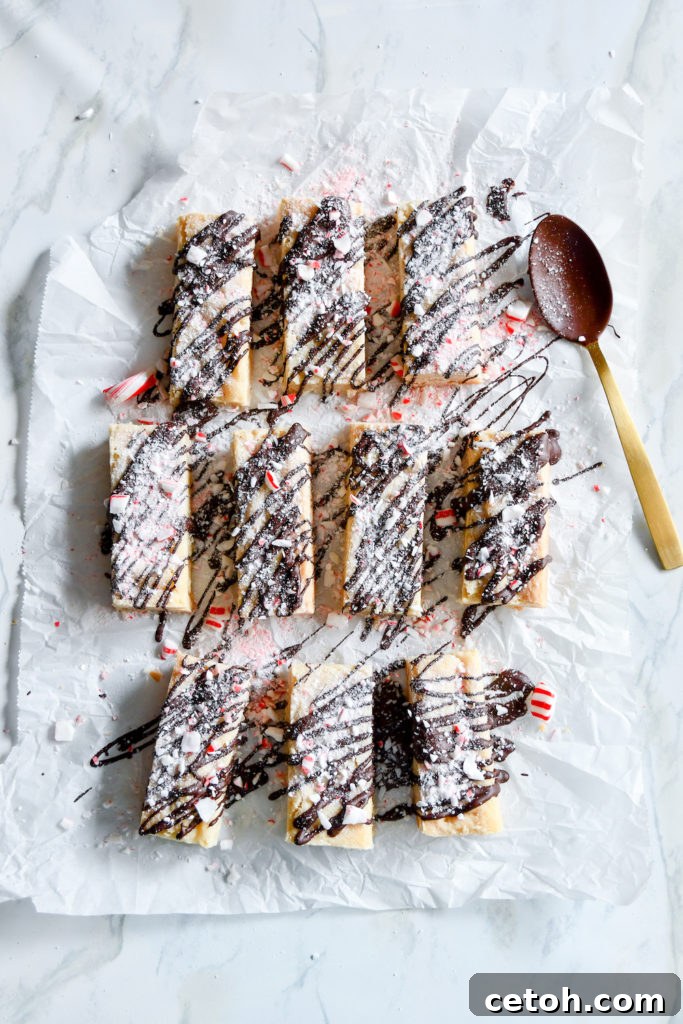 Close-up of a perfectly baked Candy Cane Shortbread bar on a cooling rack.