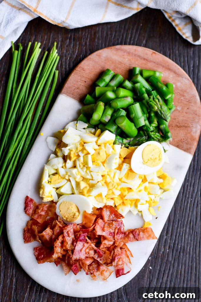 Fresh asparagus meets creamy eggs, smoky bacon, and lemon in this perfect-for-spring salad recipe!