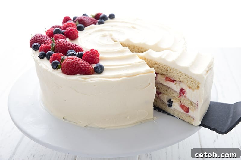 A delectable slice of keto chantilly cake being gently taken out of the whole cake on a spatula, revealing layers of cake and cream.