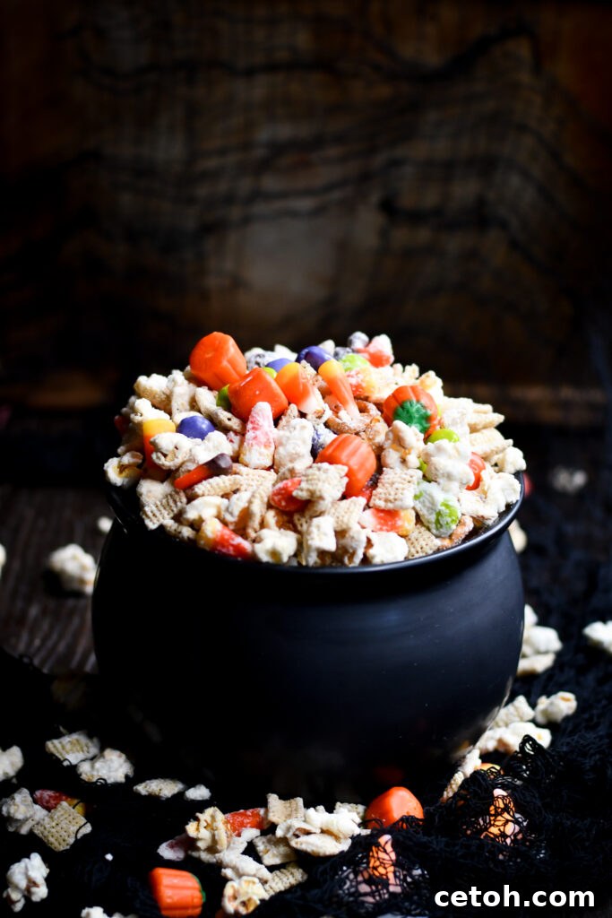 Easy Halloween Popcorn Treat with Candy Corn 2 Try our easy Halloween Popcorn Snack Mix for a spooky movie night treat! A colorful blend of popcorn, candy corn, pretzels, and M&Ms.