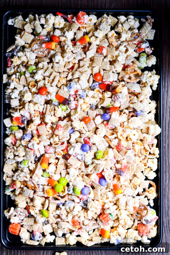Easy Halloween Popcorn Treat with Candy Corn 4 Kids will love this colorful and tasty Halloween Popcorn Snack Mix, perfect for trick-or-treat season.