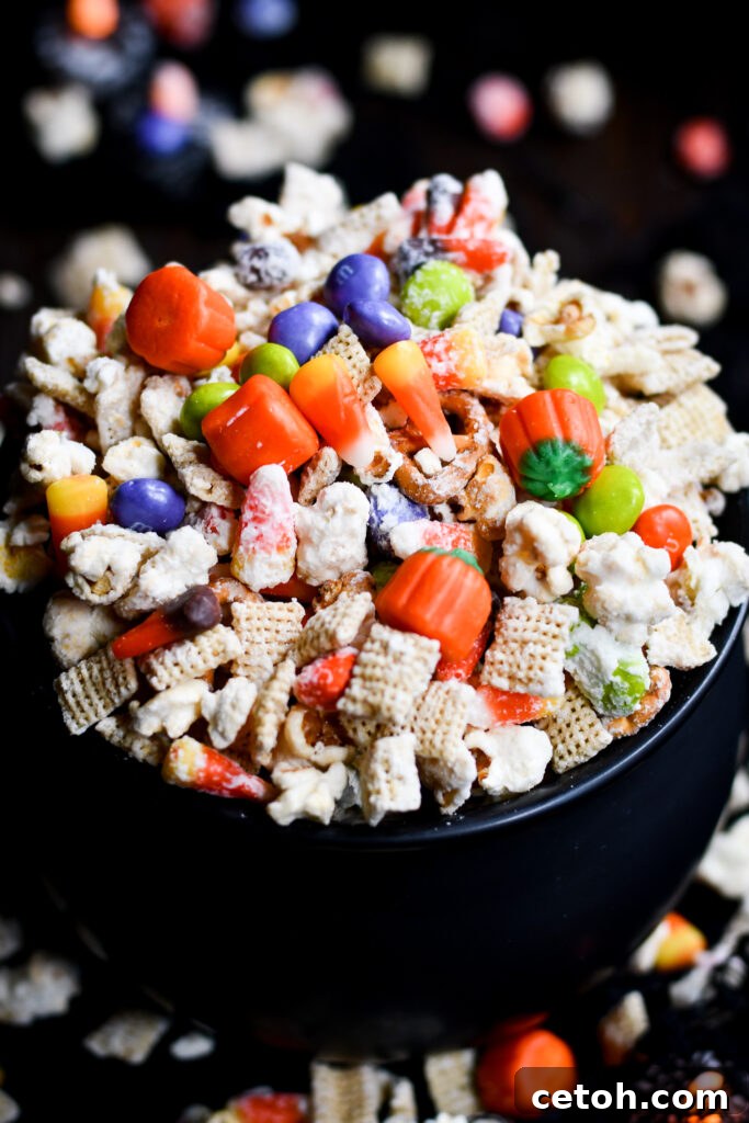 Easy Halloween Popcorn Treat with Candy Corn 5 Whip up a batch of Halloween Popcorn Snack Mix for your costume party! Easy to make and fun for all ages.