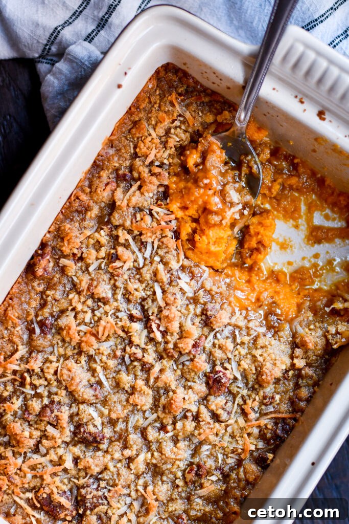 A cozy Southern classic! This creamy, buttery sweet potato casserole is topped with a golden brown sugar pecan crumble that tastes like fall in every bite. Perfect for Thanksgiving or Christmas dinner!