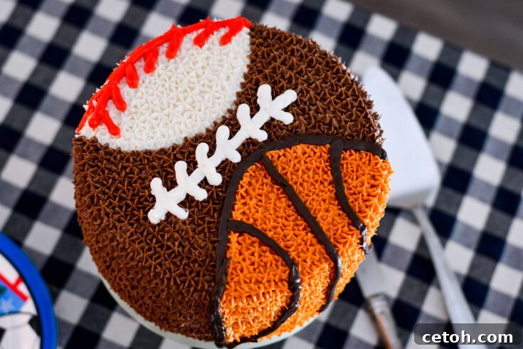 A sports-themed birthday cake featuring football, basketball, and baseball designs. A perfect dessert for any sports fan's birthday party.