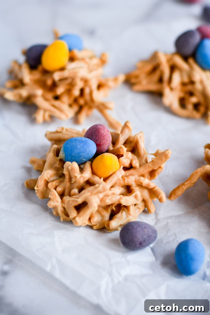 These adorable no bake Easter haystack cookies are the perfect springtime treat! Made with chow mein noodles, melted chips, and candy eggs—fun and easy for kids to help make.