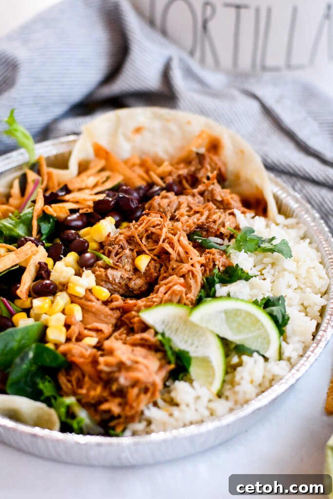 Craft the iconic Café Rio sweet pork salad at home with tender pork, zesty cilantro-lime rice, savory black beans, creamy tomatillo-ranch dressing, and crunchy tortilla toppings.