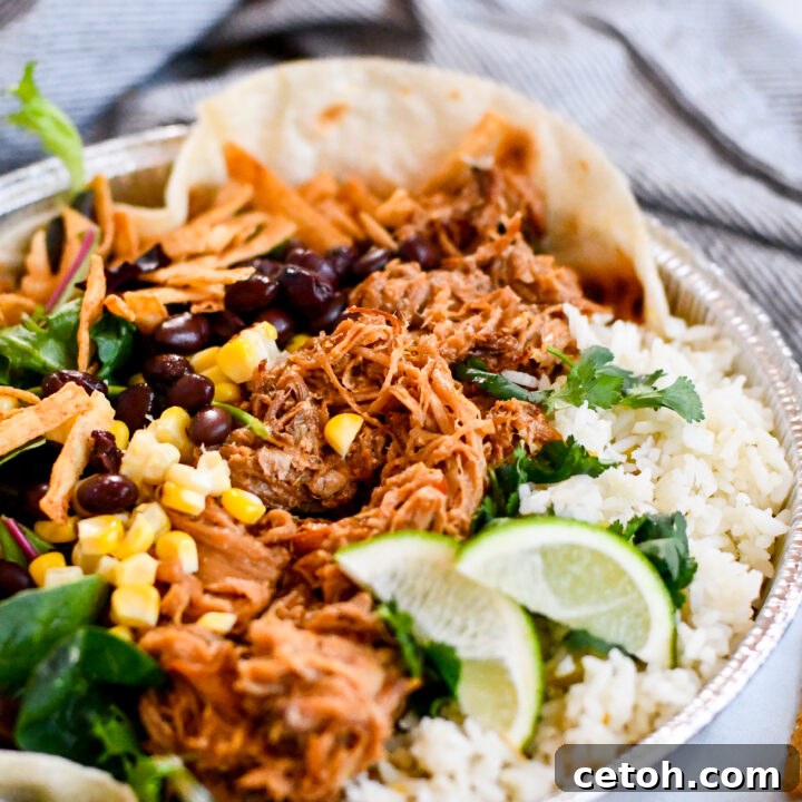 A beautifully layered homemade Café Rio sweet pork salad with tender pork, cilantro-lime rice, and creamy dressing, ready to be enjoyed.