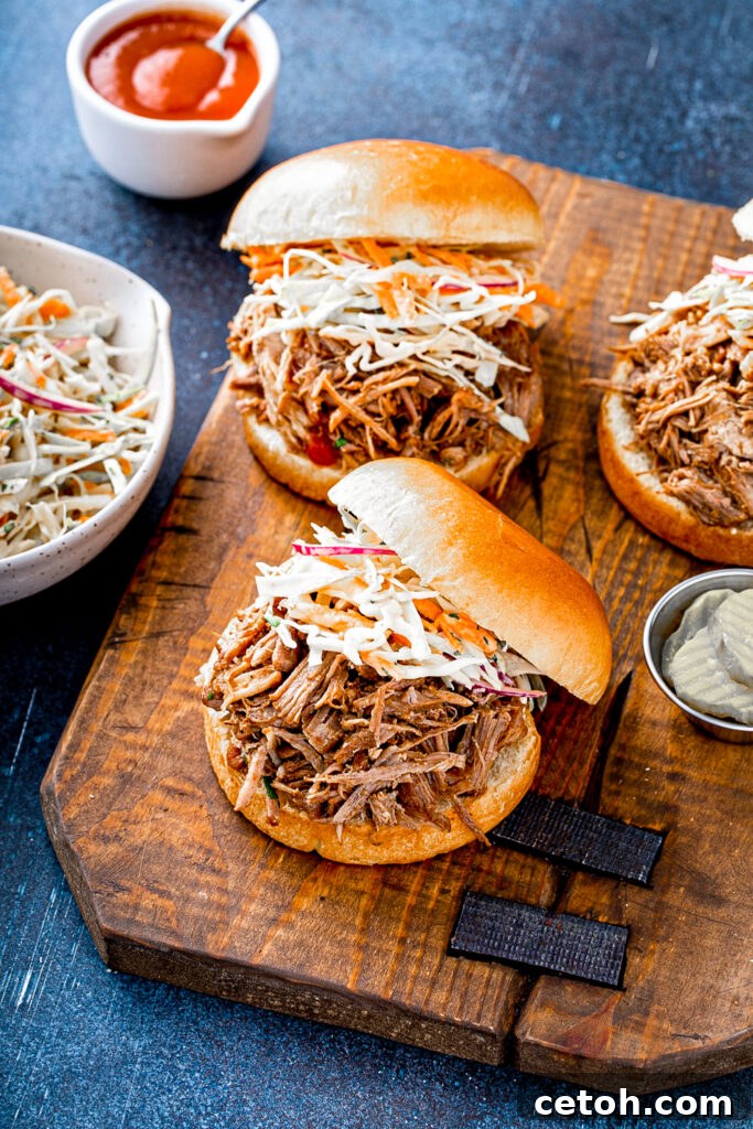 A close-up of tender, shredded Dutch Oven Boston Butt BBQ, inviting a taste.