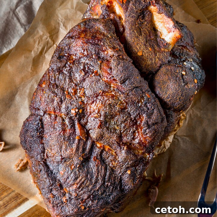 Juicy, tender Dutch Oven Boston Butt BBQ, perfect for shredding.