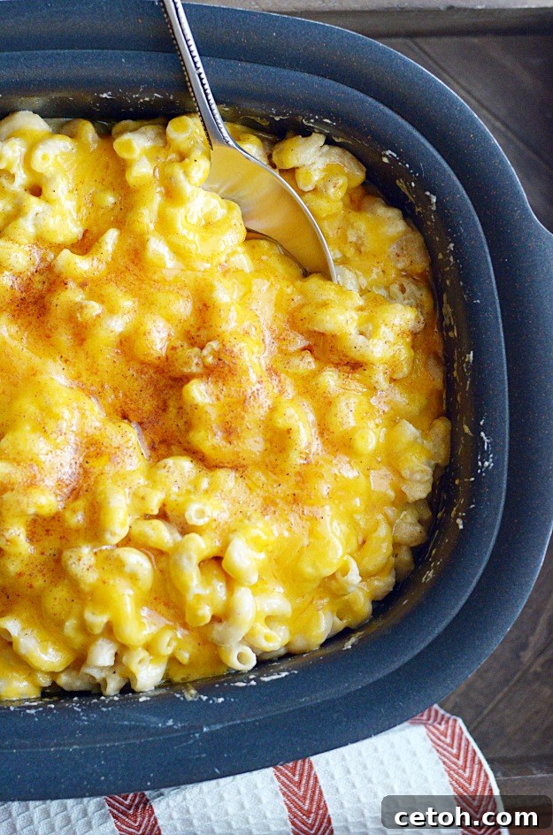 This crockpot mac & cheese is a super quick and easy dinner recipe our mom used to make us a lot. All the comfort food, none of the work!