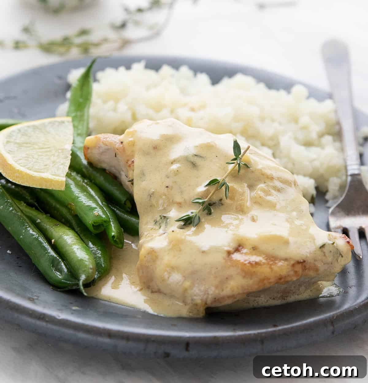 Rich and creamy Chicken Dijon ready to be served, showcasing the beautiful sauce and tender chicken.