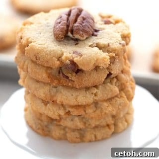 Decadent Keto Butter Pecan Delights 2 A stacked image of keto butter pecan cookies on a cupcake stand, ready to be enjoyed.