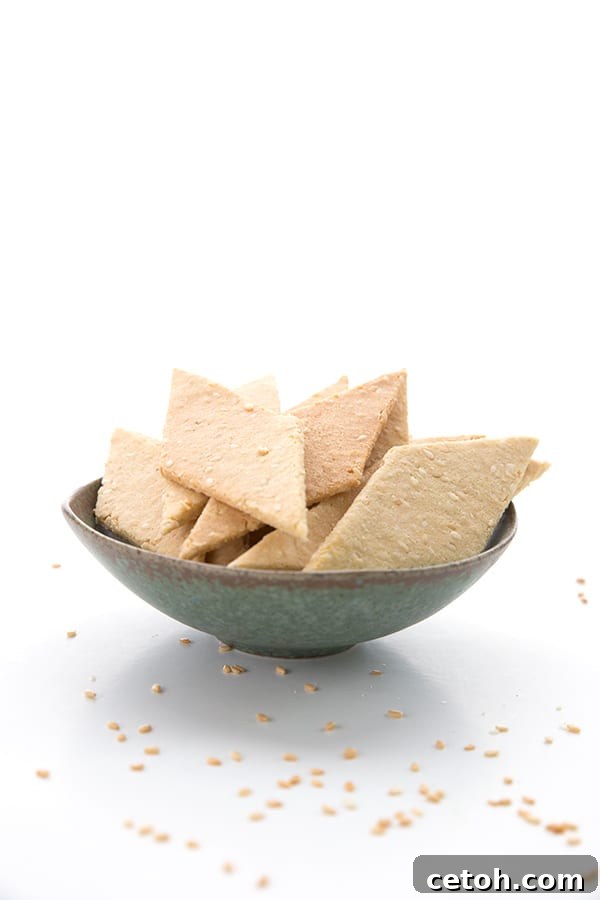 Keto toasted sesame crackers in a small bowl