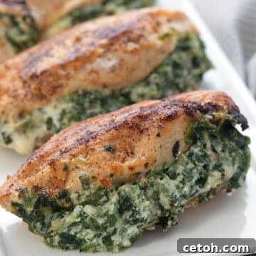 Spinach Stuffed Chicken Breasts on a white rectangular platter.