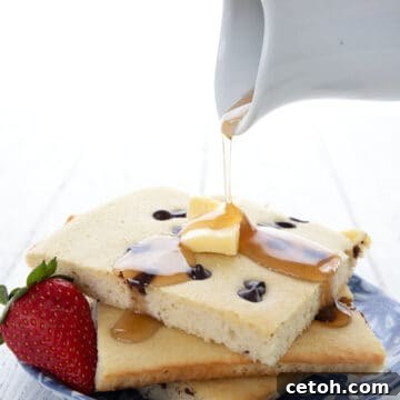 Sugar Free Maple Syrup being drizzled over Keto Sheet Pan Pancakes.