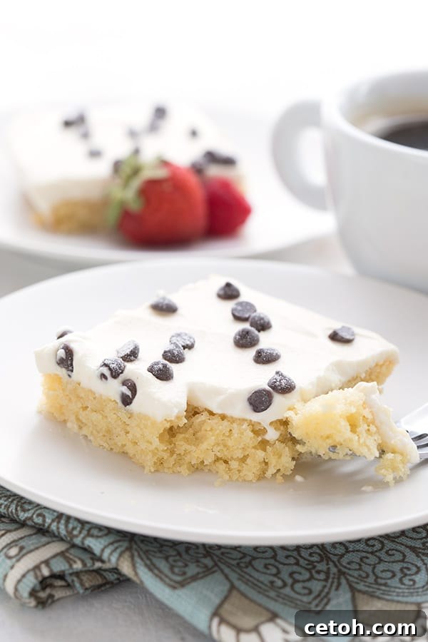 Keto Cannoli Dream Cake 6 Close up shot of cannoli sheet cake with a forkful taken out.