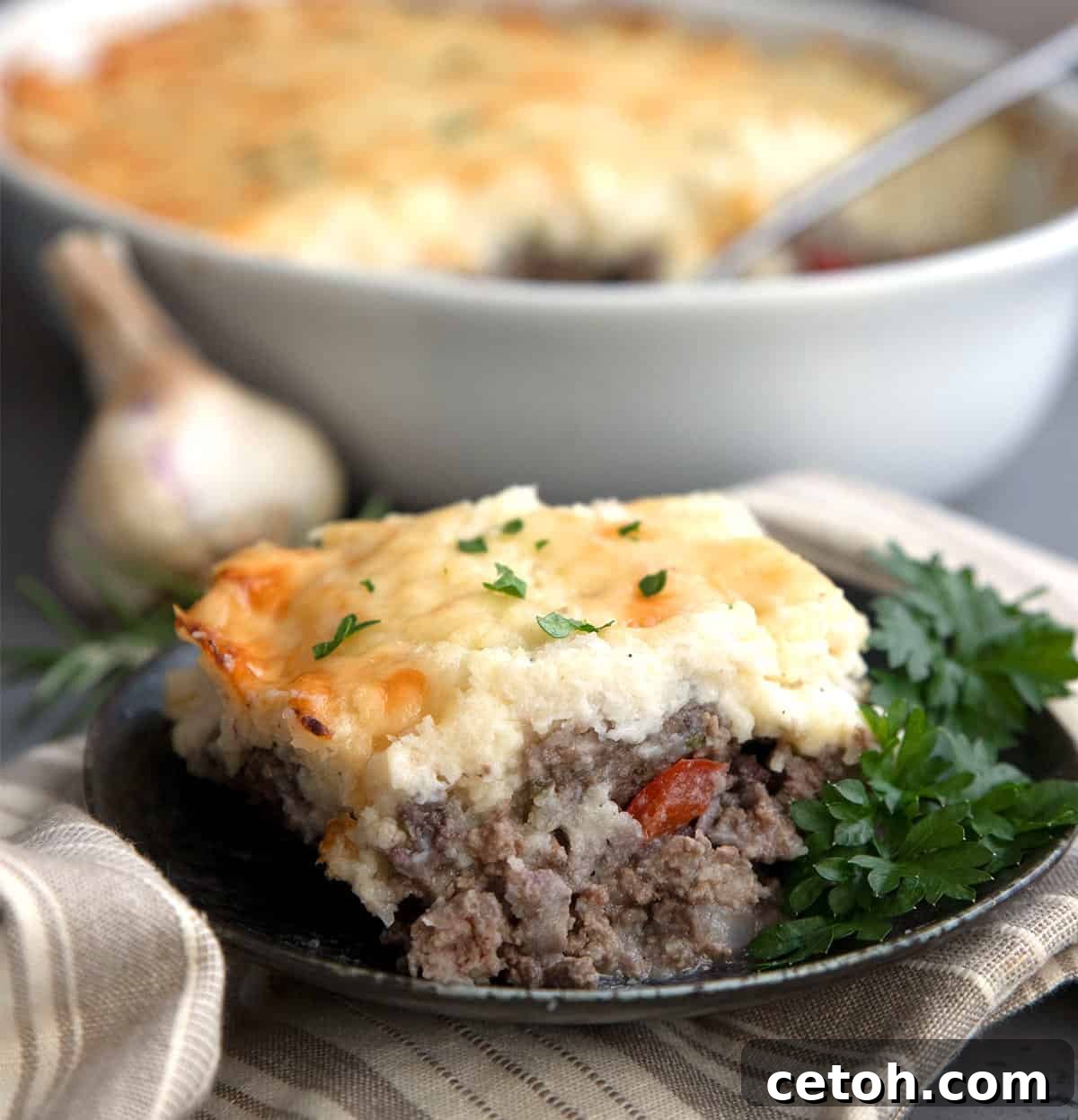 A slice of Keto Shepherd's Pie on a black plate.