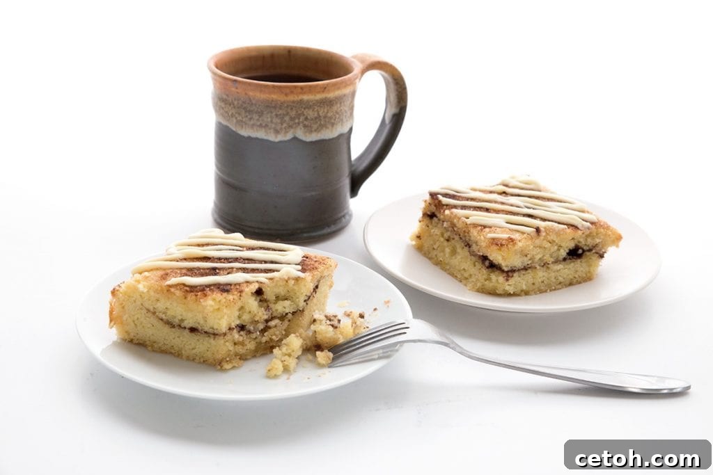 The Ultimate Keto Coffee Cake Collection 2 A perfectly baked Easy Low Carb Cinnamon Roll Coffee Cake, showcasing its beautiful cinnamon swirls and streusel topping, ready to be sliced and served with coffee.